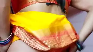 Indian shemale enjoys strip teasing and masturbating