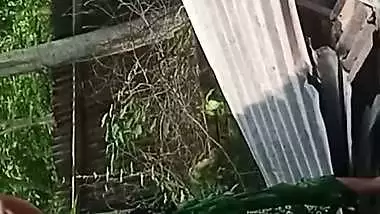 Village neighbor girl outdoor bath caught through hole