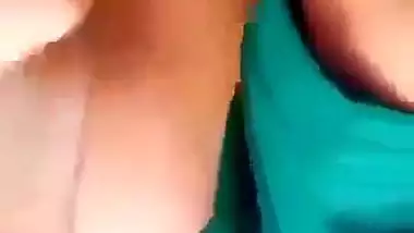 Horny girl squeezes her boobs and fingers her hairy pussy