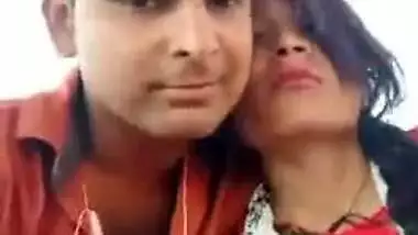 Handsome young man paws Indian's perfect boobs through red dress